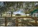 Lakefront property with wooden fence and mature trees at 15040 Ne 248Th Avenue Rd, Fort Mc Coy, FL 32134