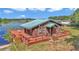Beautifully situated home with a waterfront deck offering stunning views and a serene living experience at 15040 Ne 248Th Avenue Rd, Fort Mc Coy, FL 32134