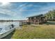 Charming waterfront cottage with wooden deck, boat, and serene water views at 15040 Ne 248Th Avenue Rd, Fort Mc Coy, FL 32134