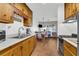 Charming kitchen area with wood cabinets, modern appliances, and a connected dining area with water views at 15040 Ne 248Th Avenue Rd, Fort Mc Coy, FL 32134