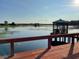 Relaxing lakefront deck with gazebo views and dock access at 15040 Ne 248Th Avenue Rd, Fort Mc Coy, FL 32134