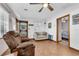 Bright living room with wood-look floors, and comfortable seating, creating a relaxing atmosphere at 15040 Ne 248Th Avenue Rd, Fort Mc Coy, FL 32134