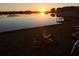 Stunning sunset reflecting on the tranquil lake from this waterfront property at 15040 Ne 248Th Avenue Rd, Fort Mc Coy, FL 32134