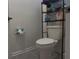 Small bathroom with toilet and storage at 1563 Cross Prairie Pkwy, Kissimmee, FL 34744