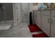 Bathroom featuring a walk-in shower and gray tile floor at 1563 Cross Prairie Pkwy, Kissimmee, FL 34744