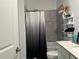 Bathroom with shower/tub, gray tile, and modern vanity at 1563 Cross Prairie Pkwy, Kissimmee, FL 34744