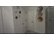 Bathroom with shower, double sinks, and decorative wall art at 1563 Cross Prairie Pkwy, Kissimmee, FL 34744