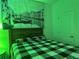 Bedroom with green walls and a large tapestry at 1563 Cross Prairie Pkwy, Kissimmee, FL 34744