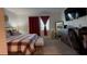 Large bedroom with ensuite bath and large TV at 1563 Cross Prairie Pkwy, Kissimmee, FL 34744