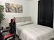 Comfortable bedroom with a bed and nightstand at 1563 Cross Prairie Pkwy, Kissimmee, FL 34744