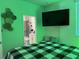 Spacious bedroom with large TV and en-suite bathroom at 1563 Cross Prairie Pkwy, Kissimmee, FL 34744