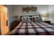 Main bedroom with ensuite bathroom and large bed at 1563 Cross Prairie Pkwy, Kissimmee, FL 34744