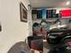 Garage with shelving, storage bins and two cars parked at 1563 Cross Prairie Pkwy, Kissimmee, FL 34744