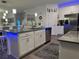 Modern kitchen with white cabinets, island, and stainless steel appliances at 1563 Cross Prairie Pkwy, Kissimmee, FL 34744