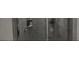 Grey tiled shower with glass enclosure at 1563 Cross Prairie Pkwy, Kissimmee, FL 34744