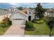One-story house with a two-car garage, and a spacious backyard at 16067 Shasta St, Clermont, FL 34714