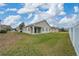 Large backyard with grassy area and fence at 16067 Shasta St, Clermont, FL 34714