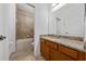 Clean bathroom with tub, shower, and granite vanity at 16067 Shasta St, Clermont, FL 34714