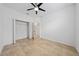 Bedroom with spacious closet and tile floors at 16067 Shasta St, Clermont, FL 34714
