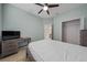 Bedroom with a bed, desk, and closet at 16067 Shasta St, Clermont, FL 34714
