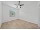 Bright bedroom with tile floors and ceiling fan at 16067 Shasta St, Clermont, FL 34714