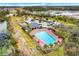 Community pool with cabana and surrounding landscaping at 16067 Shasta St, Clermont, FL 34714