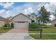 One-story home with a two-car garage and landscaped front yard at 16067 Shasta St, Clermont, FL 34714