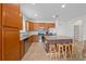 Kitchen island with granite countertop and four wooden stools at 16067 Shasta St, Clermont, FL 34714