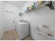 Laundry room with washer, dryer, and utility sink at 16067 Shasta St, Clermont, FL 34714