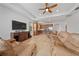 Spacious living room with comfortable leather sofas and a large TV at 16067 Shasta St, Clermont, FL 34714