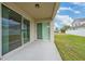 Covered patio with sliding glass doors at 16067 Shasta St, Clermont, FL 34714