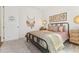 Tastefully decorated bedroom shows artwork and natural elements for a peaceful, relaxing atmosphere at 1609 Hill Park Dr, Deltona, FL 32725