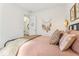 Bright bedroom with pink bedding and decorative accents for a warm and inviting ambiance at 1609 Hill Park Dr, Deltona, FL 32725
