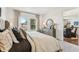 Inviting bedroom with neutral tones, soft carpet, and natural light from the windows at 1609 Hill Park Dr, Deltona, FL 32725