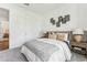 Stylish bedroom featuring neutral walls, carpet flooring, and framed floral decor at 1609 Hill Park Dr, Deltona, FL 32725