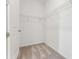 Empty walk-in closet features carpeted floors and wire shelving for storage at 1609 Hill Park Dr, Deltona, FL 32725