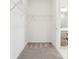 Carpeted walk-in closet with white walls, wire shelving, and access to the bathroom at 1609 Hill Park Dr, Deltona, FL 32725