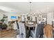 Open dining room with chandelier and access to kitchen and living spaces at 1609 Hill Park Dr, Deltona, FL 32725