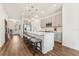 This modern kitchen features stainless steel appliances, gray cabinetry, a center island, and pendant lighting at 1609 Hill Park Dr, Deltona, FL 32725