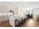 Modern kitchen with an island, pendant lighting, stainless steel appliances, and breakfast bar at 1609 Hill Park Dr, Deltona, FL 32725
