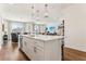 Kitchen island featuring a stainless steel dishwasher, sink and faucet, and an open-concept view at 1609 Hill Park Dr, Deltona, FL 32725