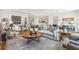 Spacious living room with modern decor and an open floor plan to the kitchen at 1609 Hill Park Dr, Deltona, FL 32725
