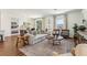 Bright living room with a large window, comfortable seating, and stylish decor at 1609 Hill Park Dr, Deltona, FL 32725