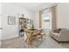Bright home office with wooden desk, comfortable seating, and ample natural light at 1609 Hill Park Dr, Deltona, FL 32725
