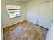 Bedroom featuring tiled floors, a window, and a closet at 2101 La Due Ct, Orlando, FL 32811