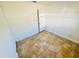 A bright, empty room with tan tiled floors, white walls, and a closet with white door at 2101 La Due Ct, Orlando, FL 32811