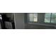 Bright dining area with large windows and a view into the kitchen at 2101 La Due Ct, Orlando, FL 32811