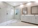Modern bathroom features a spacious glass shower and double vanity with white cabinets at 231 Chestnut Ridge St, Winter Springs, FL 32708