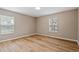 Cozy bedroom with natural light and wood floors at 231 Chestnut Ridge St, Winter Springs, FL 32708