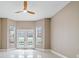 Bright bedroom with neutral walls, glossy tile flooring, and direct access to the backyard pool at 231 Chestnut Ridge St, Winter Springs, FL 32708